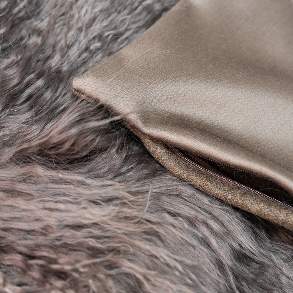 Zipper detail of Chocolate Holly Hunt Wool and Shearling Pillow Cover.