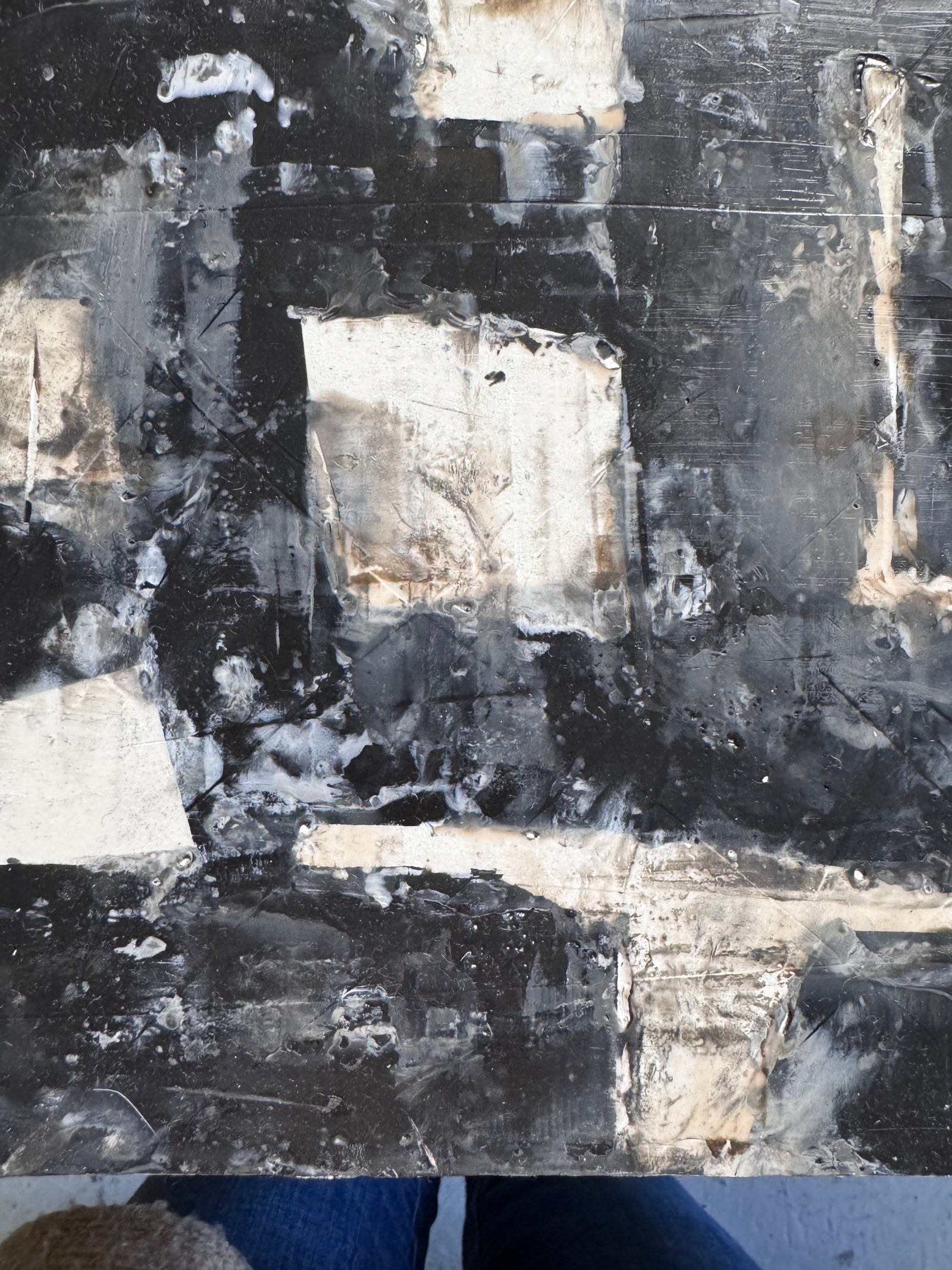 Abstract art piece with black, white, and gray tones