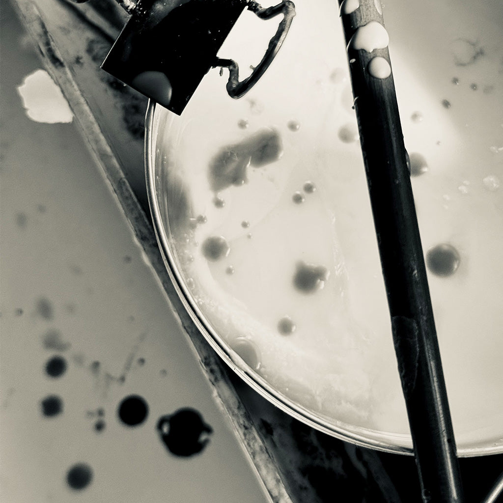 A sepia photograph of wax for encaustic painting.