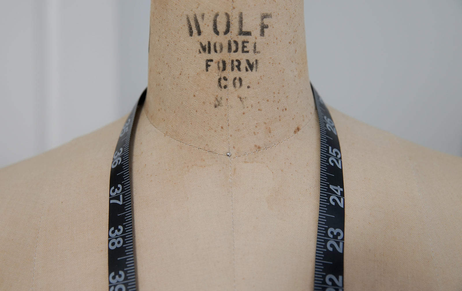 Vintage Wolf Model Form Co. dress form with measuring tape draped around the neck, ADALÉI Studio, Raleigh NC

