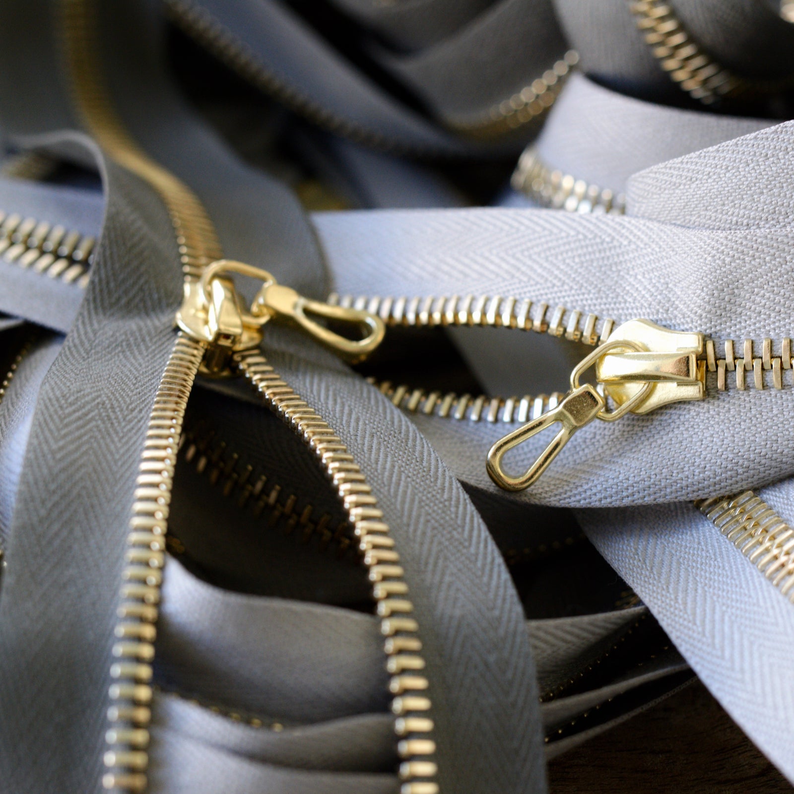 Gray YKK Zippers with brass pulls